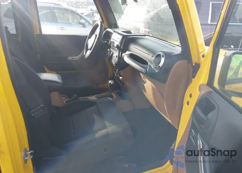 2011 Jeep Wrangler Unlimited Sahara z USA, uszkodzony, nr VIN 1J4HA5H16BL553709